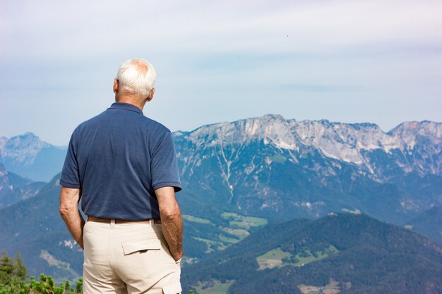 old-man-looks-alpine-mountains_79276-282.jpg