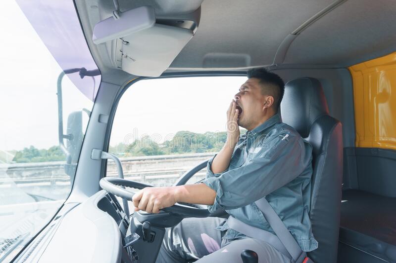 professional-truck-driver-adult-male-safety-belt-yawning-sleepy-young-man-worker-confident-saf...jpg